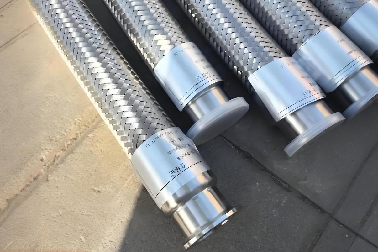 Braided hydraulic hose with reinforcement layers visible in cutaway view