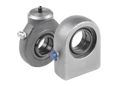 Various types of bearings used in hydraulic systems displayed on a technical workbench