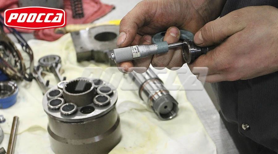 Hydraulic pump suction side components including inlet strainer, hoses, and reservoir connections